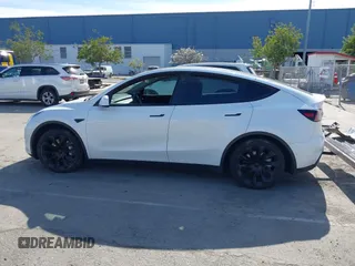 2022 Tesla Model Y Long Range with VIN 7SAYGDEE0NF340822, listed as a IAAI auction lot 41881224 with Not Provided miles and . Bid and sale history available at DreamBid. Image 15.