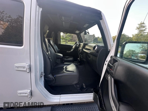 2016 Jeep Wrangler Unlimited Sahara with VIN 1C4BJWEG5GL215915, listed as a Copart auction lot 61690145 with 143,925 mi miles and Clean title. Bid and sale history available at DreamBid. Image 5.