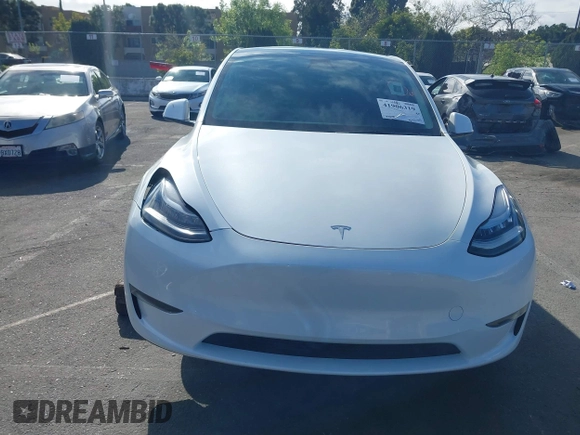 2023 Tesla Model Y Long Range with VIN 7SAYGDEE9PA094191, listed as a IAAI auction lot 41906319 with 15,240 mi miles and . Bid and sale history available at DreamBid. Image 13.