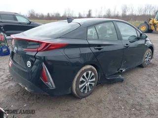 2021 Toyota Prius Prime LE with VIN JTDKAMFP2M3165859, listed as a IAAI auction lot 41943098 with 20,306 mi miles. Bid and sale history available at carsss.com. Image 4.
