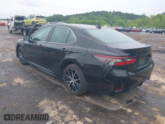 2023 Toyota Camry SE with VIN 4T1G11AKXPU827360, listed as a IAAI auction lot 42217356 with 57,497 mi miles and . Bid and sale history available at DreamBid. Image 3.