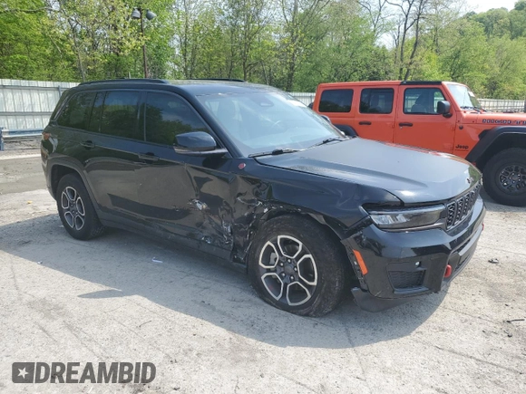 2022 Jeep Grand Cherokee Trailhawk with VIN 1C4RJHCG7N8574289, listed as a Copart auction lot 56333165 with 23,522 mi miles and Salvage title. Bid and sale history available at DreamBid. Image 4.