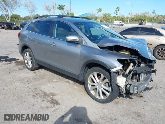 2015 Mazda CX-9 Sport with VIN JM3TB2BA1F0467162, listed as a IAAI auction lot 41565602 with 127,957 mi miles and . Bid and sale history available at carsss.com. Image 1.