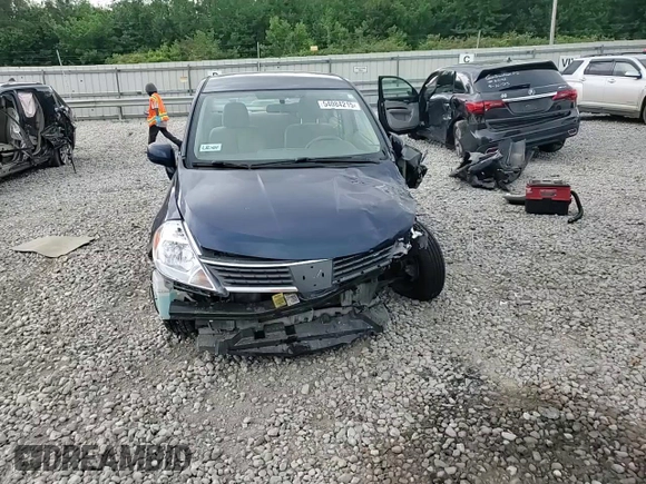 2009 Nissan Versa S with VIN 3N1BC11E19L433572, listed as a Copart auction lot 54084215 with 144,178 mi miles and Salvage title. Bid and sale history available at DreamBid. Image 14.