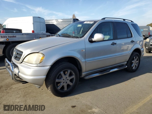 2000 Mercedes-Benz M 320/430/500 with VIN 4JGAB72E2YA185234, listed as a Copart auction lot 83479684 with 209,491 mi miles and Clean title. Bid and sale history available at DreamBid. Image 1.