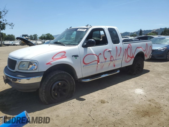 1999 Ford F-150 with VIN 1FTZX1727XKA70271, listed as a Copart auction lot 58016095 with 219,093 mi miles and Salvage title. Bid and sale history available at DreamBid. Image 1.