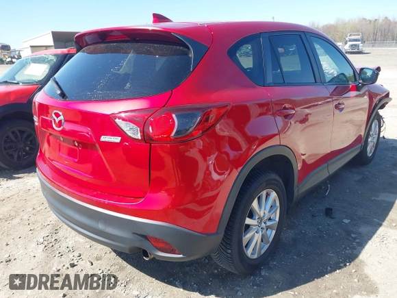 2016 Mazda CX-5 Touring with VIN JM3KE4CY0G0890309, listed as a IAAI auction lot 41890840 with 89,023 mi miles and . Bid and sale history available at carsss.com. Image 4.