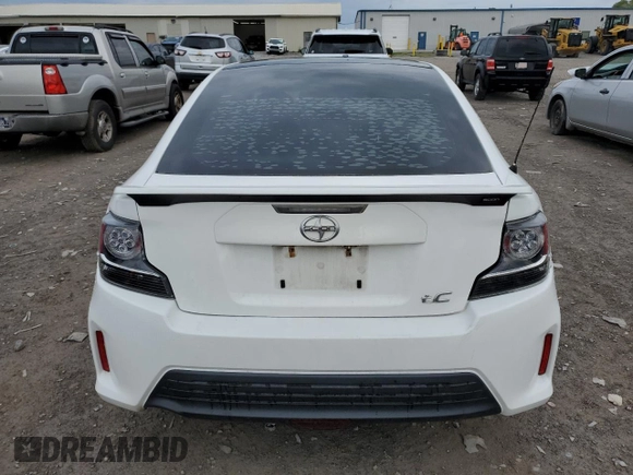 2014 Scion tC z VIN JTKJF5C70E3084411, wystawiony jako Copart lot #54255385 z przebiegiem 152 715 mil mil oraz Szkoda całkowita • Salvage title. Historia ofert i sprzedaży dostępna na DreamBid. Obrazek 6.