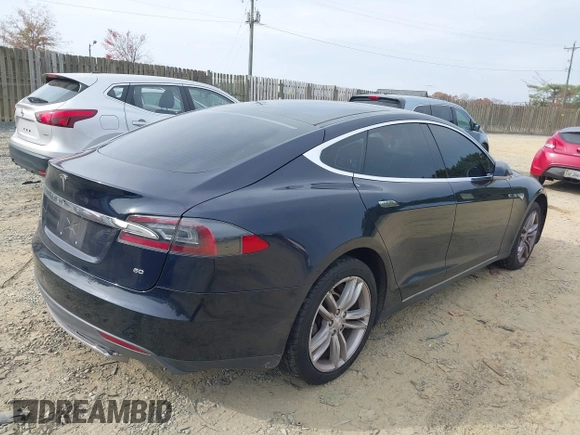 2014 Tesla Model S 60 with VIN 5YJSA1S12EFP42605, listed as a IAAI auction lot 40905031 with 68,155 mi miles and . Bid and sale history available at DreamBid. Image 4.