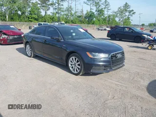 2015 Audi A6 3.0T Prestige with VIN WAUHGAFC3FN011654, listed as a IAAI auction lot 42104153 with 166,719 mi miles. Bid and sale history available at carsss.com. Image 1.