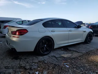 2016 BMW M6 z VIN WBS6E9C51GG437202, wystawiony jako Copart lot #71389434 z przebiegiem 80 673 mil mil oraz Szkoda całkowita • Salvage title. Historia ofert i sprzedaży dostępna na DreamBid. Obrazek 3.
