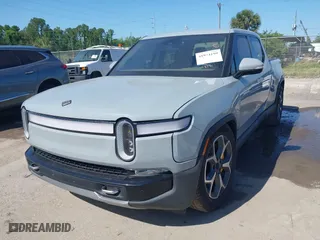 2022 Rivian R1T Adventure Package with VIN 7FCTGAAA2NN006053, listed as a IAAI auction lot 41974199 with 286 mi miles. Bid and sale history available at carsss.com. Image 2.