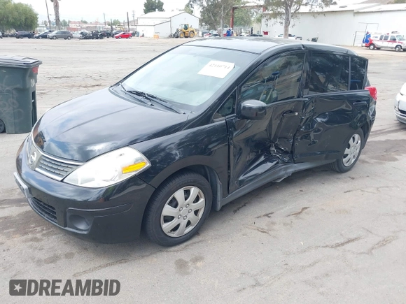 2009 Nissan Versa 1.8 S with VIN 3N1BC13E59L498728, listed as a IAAI auction lot 42110714 with 158,811 mi miles. Bid and sale history available at carsss.com. Image 2.
