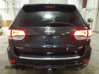 2015 Jeep Grand Cherokee Overland with VIN 1C4RJFCG7FC911899, listed as a Copart auction lot 54123925 with 243,031 mi miles and Salvage Title. Bid and sale history available at carsss.com. Image 6.