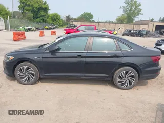 2020 Volkswagen Jetta SEL z VIN 3VWEB7BU9LM023817, wystawiony jako IAAI lot #42371694 z przebiegiem 99 100 mil mil oraz . Historia ofert i sprzedaży dostępna na DreamBid. Obrazek 14.