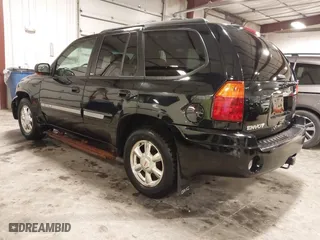 2004 GMC Envoy SLE with VIN 1GKDT13S542265104, listed as a IAAI auction lot 41884797 with 154,190 mi miles. Bid and sale history available at carsss.com. Image 3.