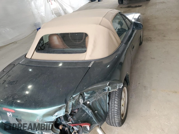 1999 Mazda MX-5 Miata z VIN JM1NB353XX0111850, wystawiony jako Copart lot #53076805 z przebiegiem 128 707 mil mil oraz Szkoda całkowita • Salvage title. Historia ofert i sprzedaży dostępna na DreamBid. Obrazek 10.