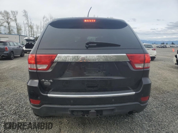 2013 Jeep Grand Cherokee Overland with VIN 1C4RJFCGXDC643802, listed as a Copart auction lot 52429535 with 122,014 mi miles and Salvage Title. Bid and sale history available at carsss.com. Image 6.