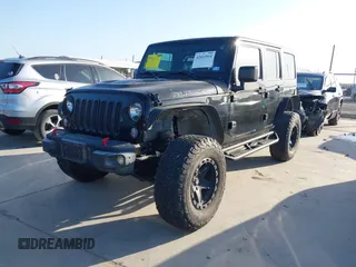 2015 Jeep Wrangler Unlimited Rubicon Hard Rock with VIN 1C4HJWFG7FL602344, listed as a IAAI auction lot 42011914 with 109,238 mi miles and . Bid and sale history available at DreamBid. Image 17.