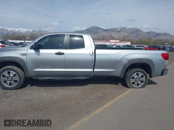 2012 Toyota Tundra 4WD Truck SR with VIN 5TFCW5F19CX012832, listed as a IAAI auction lot 41726453 with 232,078 mi miles. Bid and sale history available at carsss.com. Image 14.
