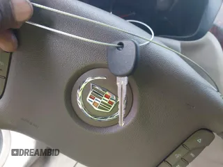 2006 Cadillac DTS w/1SC with VIN 1G6KD57Y36U116528, listed as a IAAI auction lot 42063595 with 128,839 mi miles. Bid and sale history available at carsss.com. Image 11.