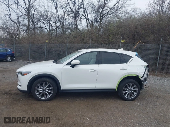2020 Mazda CX-5 Grand Touring with VIN JM3KFBDM5L0731373, listed as a IAAI auction lot 41900567 with 31,268 mi miles and . Bid and sale history available at DreamBid. Image 14.