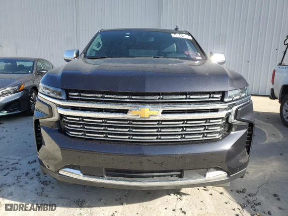 2023 Chevrolet Suburban Premier with VIN 1GNSCFKD5PR394675, listed as a Copart auction lot 49641395 with 56,946 mi miles and Salvage Title. Bid and sale history available at carsss.com. Image 5.
