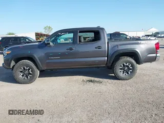 2017 Toyota Tacoma SR5 with VIN 5TFCZ5AN5HX077315, listed as a IAAI auction lot 42017639 with 74,999 mi miles and . Bid and sale history available at DreamBid. Image 14.