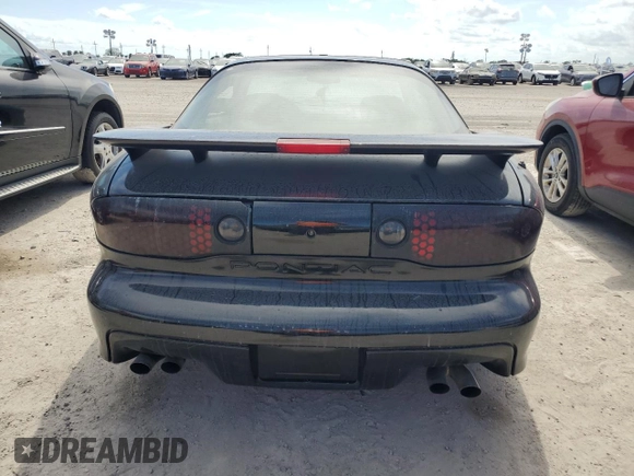 2000 Pontiac Firebird Formula z VIN 2G2FV22G9Y2140113, wystawiony jako Copart lot #76135324 z przebiegiem Nie podano mil oraz Szkoda całkowita • Salvage title. Historia ofert i sprzedaży dostępna na DreamBid. Obrazek 6.