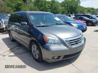 2010 Honda Odyssey Touring with VIN 5FNRL3H90AB053710, listed as a IAAI auction lot 42577646 with 255,351 mi miles and . Bid and sale history available at DreamBid. Image 1.