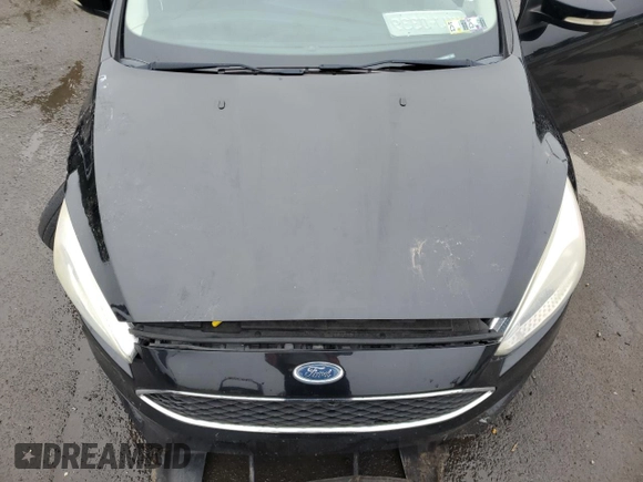 2016 Ford Focus SE z VIN 1FADP3F26GL340954, wystawiony jako Copart lot #60989915 z przebiegiem 26 052 mil mil oraz Szkoda całkowita • Salvage title. Historia ofert i sprzedaży dostępna na DreamBid. Obrazek 11.
