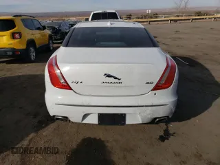 2014 Jaguar XJ with VIN SAJWA2GZ7E8V69543, listed as a Copart auction lot 86390204 with 110,929 mi miles and Salvage Title. Bid and sale history available at carsss.com. Image 6.
