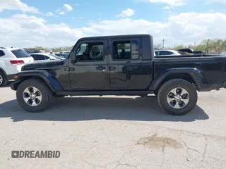 2021 Jeep Gladiator Willys with VIN 1C6HJTAG7ML523718, listed as a IAAI auction lot 42206058 with 48,071 mi miles and . Bid and sale history available at DreamBid. Image 14.
