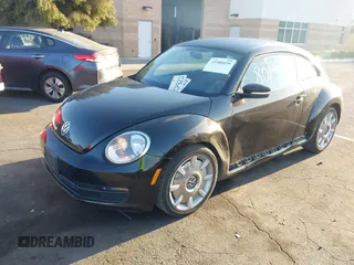 2012 Volkswagen Beetle 2.5L w/Sound/Nav PZEV with VIN 3VWJP7AT7CM661055, listed as a IAAI auction lot 41980159 with 113,678 mi miles and . Bid and sale history available at DreamBid. Image 2.
