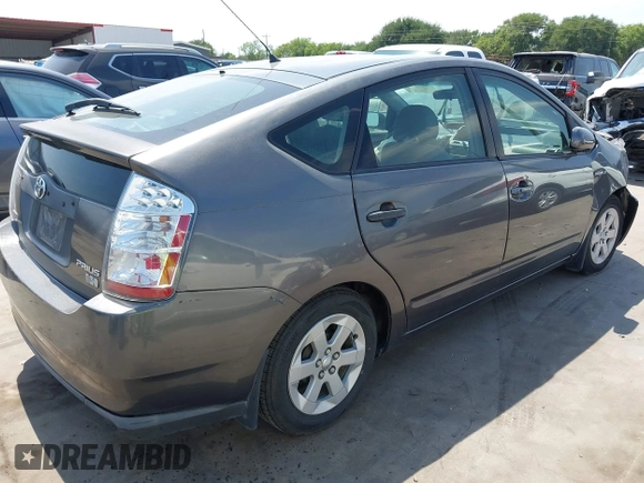 2007 Toyota Prius z VIN JTDKB20U173242693, wystawiony jako IAAI lot #42310546 z przebiegiem 250 887 mil mil oraz . Historia ofert i sprzedaży dostępna na DreamBid. Obrazek 4.