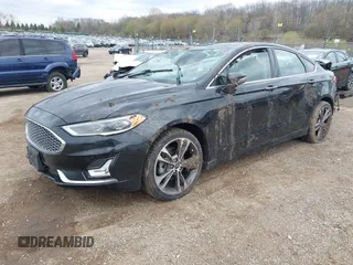2020 Ford Fusion Titanium with VIN 3FA6P0D9XLR174523, listed as a IAAI auction lot 42100113 with 100,602 mi miles and . Bid and sale history available at DreamBid. Image 2.