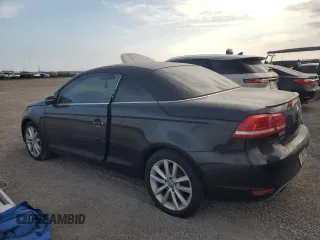 2015 Volkswagen Eos Komfort with VIN WVWBW8AH8FV002052, listed as a Copart auction lot 76487114 with Not Provided miles and Salvage Title. Bid and sale history available at DreamBid. Image 2.