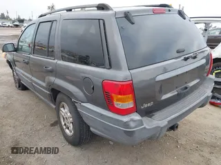 2004 Jeep Grand Cherokee Laredo with VIN 1J4GX48S34C214485, listed as a IAAI auction lot 42208120 with 164,322 mi miles and . Bid and sale history available at DreamBid. Image 3.
