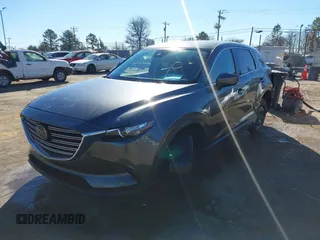 2022 Mazda CX-9 Sport with VIN JM3TCBBY5N0614589, listed as a IAAI auction lot 41295944 with 49,193 mi miles and . Bid and sale history available at DreamBid. Image 2.