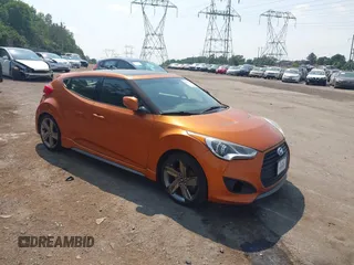 2014 Hyundai Veloster Turbo z VIN KMHTC6AE7EU191851, wystawiony jako IAAI lot #42872565 z przebiegiem 92 975 mil mil oraz . Historia ofert i sprzedaży dostępna na DreamBid. Obrazek 1.