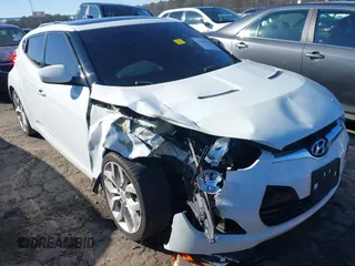 2013 Hyundai Veloster w/Black Int with VIN KMHTC6AD5DU116443, listed as a IAAI auction lot 41635858 with 170,173 mi miles and . Bid and sale history available at DreamBid. Image 1.