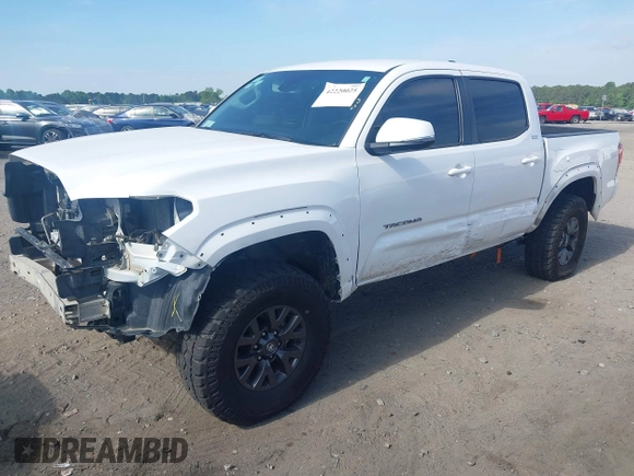 2023 Toyota Tacoma SR with VIN 3TYCZ5AN2PT112854, listed as a IAAI auction lot 42220025 with 43,657 mi miles and . Bid and sale history available at DreamBid. Image 2.