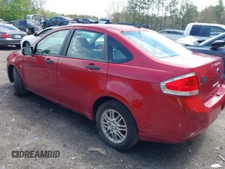 2009 Ford Focus SE with VIN 1FAHP35N89W243205, listed as a IAAI auction lot 42149989 with 148,058 mi miles. Bid and sale history available at carsss.com. Image 3.