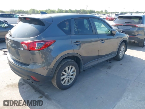 2015 Mazda CX-5 Touring with VIN JM3KE2CY9F0468199, listed as a IAAI auction lot 42099253 with 110,909 mi miles and . Bid and sale history available at carsss.com. Image 4.