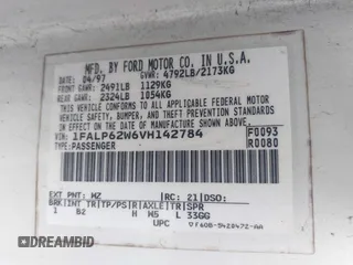 1997 Ford Thunderbird LX with VIN 1FALP62W6VH142784, listed as a IAAI auction lot 41792883 with 244,300 mi miles. Bid and sale history available at carsss.com. Image 9.