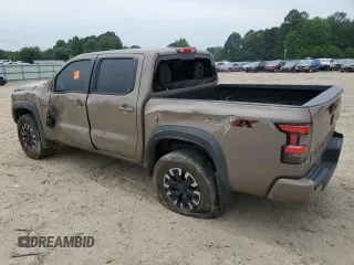 2023 Nissan Frontier Pro-4X with VIN 1N6ED1EK0PN617872, listed as a Copart auction lot 57125435 with 97,981 mi miles and Salvage title. Bid and sale history available at DreamBid. Image 2.