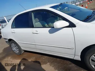 2004 Toyota Corolla CE with VIN JTDBR32E540051928, listed as a IAAI auction lot 41958483 with 299,999 mi miles. Bid and sale history available at carsss.com. Image 14.