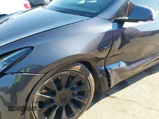 2022 Tesla Model Y Long Range z VIN 7SAYGDEE4NF522698, wystawiony jako IAAI lot #41287885 z przebiegiem 82 306 mil mil oraz . Historia ofert i sprzedaży dostępna na DreamBid. Obrazek 6.
