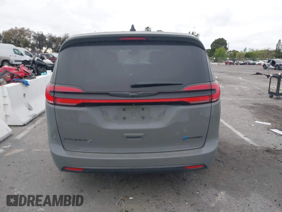 2023 Chrysler Pacifica Hybrid Touring L with VIN 2C4RC1L71PR584485, listed as a IAAI auction lot 42056423 with 58,955 mi miles and . Bid and sale history available at DreamBid. Image 17.