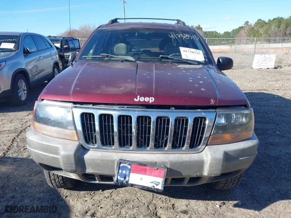 1999 Jeep Grand Cherokee Laredo with VIN 1J4GW58S5XC781472, listed as a IAAI auction lot 41738515 with 216,000 mi miles. Bid and sale history available at carsss.com. Image 6.
